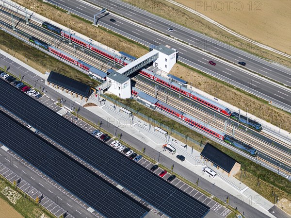 RegionalExpress RE200 of Deutsche Bahn AG, Merklingen Swabian Alb station on the new Stuttgart to Ulm line. E-cars are charged under the solar roof at the Alb station. 260 solar carports can be found under the two 160 and 190 metre long roofs, drone photo, Merklingen, Baden-Württemberg, Germany, Europe