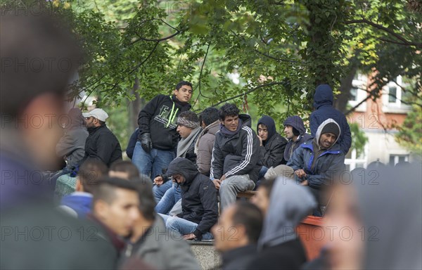 Refugees from Syria waiting to be registered at the Central Reception Centre for Asylum Seekers at the Berlin State Office for Health and Social Affairs, 09.10.2015