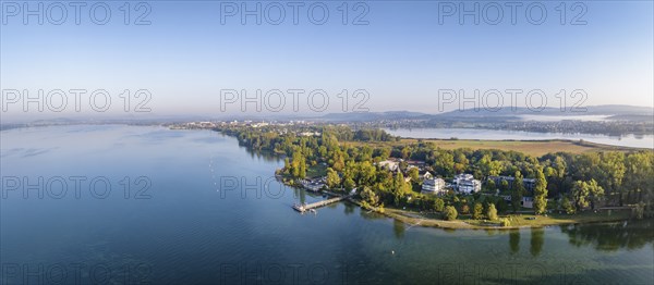 Aerial panorama of the Mettnau peninsula with the landing stage, solar ferry, restaurant and spa centre, on the right on the horizon the village of Markelfingen, Radolfzell on Lake Constance, Constance district, Baden-Württemberg, Germany, Europe