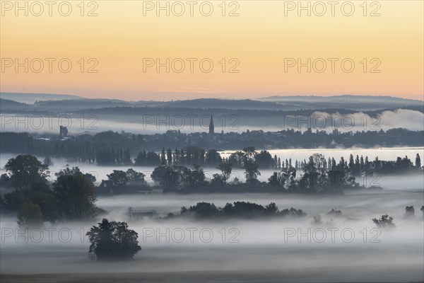Early morning fog over the Radolfzeller Aachried, behind it Lake Constance with the town of Radolfzell, district of Constance, Baden-Württemberg, Germany, Europe