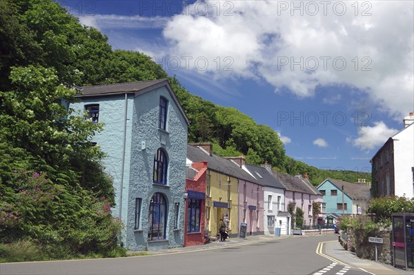 Brightly coloured houses in a village street near Tenby, Pembrokeshire, Wales, United Kingdom, Europe