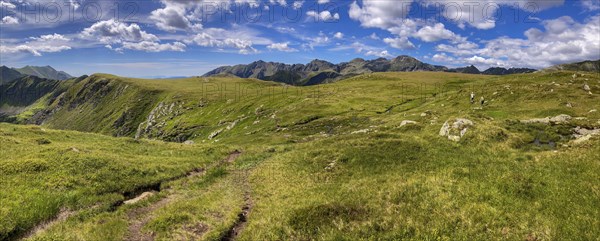 2 hikers on the plateau of the Etrachböden on the way to the Deneck in the Niedere Tauern, Sölktal region, Styria, Austria, Europe