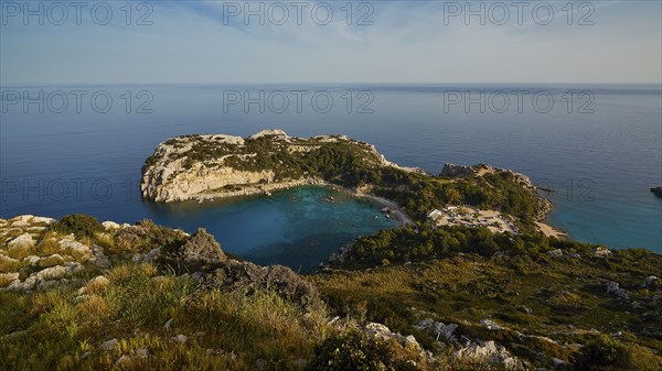 Coastal landscape with rocky cliffs and clear blue water under a sunny sky, Anthony Quinn Bay, Vagies Bay, Rhodes, Dodecanese, Greek Islands, Greece, Europe