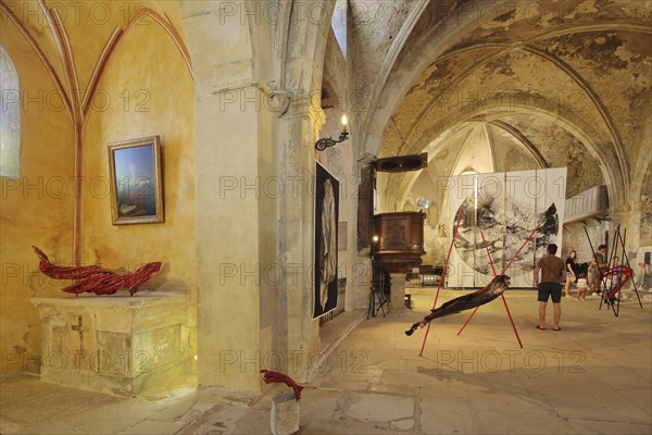 Art exhibition in the church Sainte-Marie de l'Assomption, interior view, visitors, Vaison-la-Romaine, Vaucluse, Provence, France, Europe