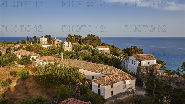 Panoramic view of houses with red gabled roofs and churches, sea, evening light, Koroni, Byzantine fortress, nunnery, Peloponnese, Greece, Europe