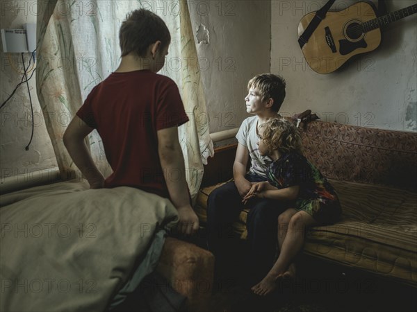 Sasha, 9 years old, Dima, 12 years old and Nastya, 5 years old. They live in the village of Borshchivka, which was occupied by the Russian army for over six months. They suffer from anxiety disorders, the front is only a few kilometres away as the crow flies, Borshchivka, Raion Isyum, Kharkiv Oblast, Ukraine, Europe