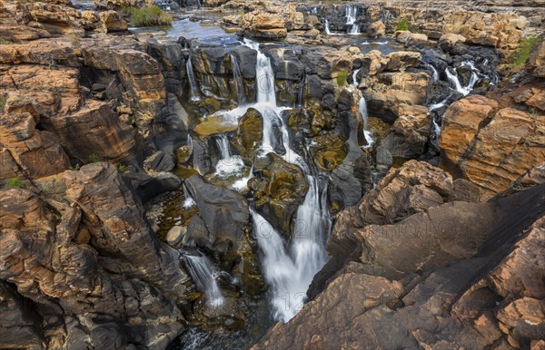 Waterfalls between orange-coloured rocks on the Treur River, Bourke's Luck Potholes, long exposure, Panorama Route, Mpumalanga, South Africa, Africa