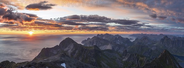 Panorama, view over mountain tops and sea, dramatic sunset, from the top of Hermannsdalstinden, Moskenesöy, Lofoten, Nordland, Norway, Europe