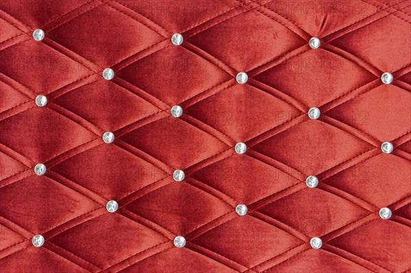 Red upholstery pattern with zircons decoration background