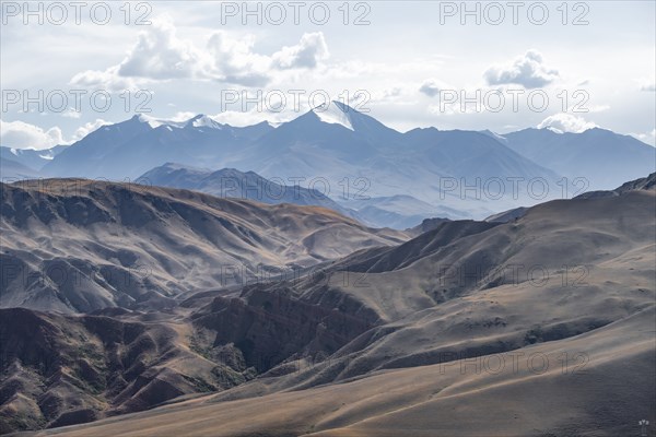 View over eroded mountainous landscape with brown hills, mountains and steppe, Chuy province, Kyrgyzstan, Asia
