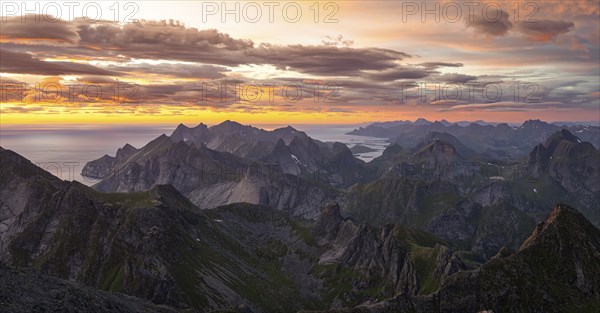 View over mountain top and sea, dramatic sunset, from the top of Hermannsdalstinden, Moskenesöy, Lofoten, Nordland, Norway, Europe