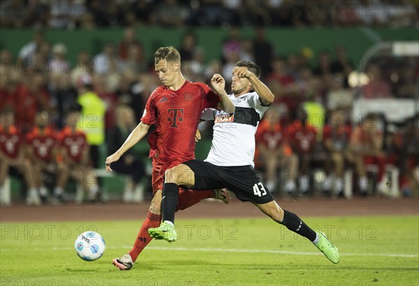 Football match, Joshua KIMMICH FC Bayern Munich left on the ball is tried to interfere with a creche by Romario RÖSCH SSV Ulm, football stadium Donaustadion, Ulm, Germany, Europe