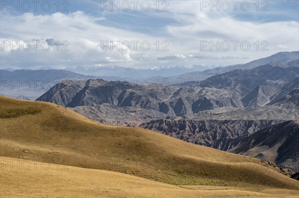 View over eroded mountainous landscape with brown hills, mountains and steppe, Chuy province, Kyrgyzstan, Asia