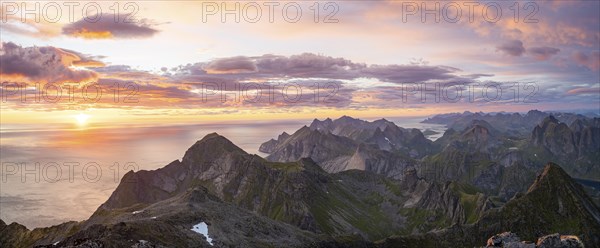 View over mountain top and sea, dramatic sunset, from the top of Hermannsdalstinden, Moskenesöy, Lofoten, Nordland, Norway, Europe