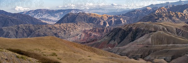 View over eroded mountainous landscape with brown hills, mountains and steppe, Chuy province, Kyrgyzstan, Asia