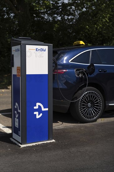 Mercedes-Benz E-Taxi at charging station EnBW for electric cars, electric charging station, e-filling station, e-mobility, charging cable leads in e-car, Stuttgart, Baden-Württemberg, Germany, Europe