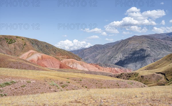 View over eroded mountainous landscape with brown hills, mountains and steppe, Chuy province, Kyrgyzstan, Asia
