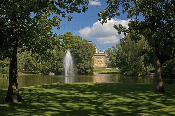 Fountain in the pond, Warmer Damm Landscape Park with Hessian State Theatre, Wiesbaden, Hesse, Germany, Europe