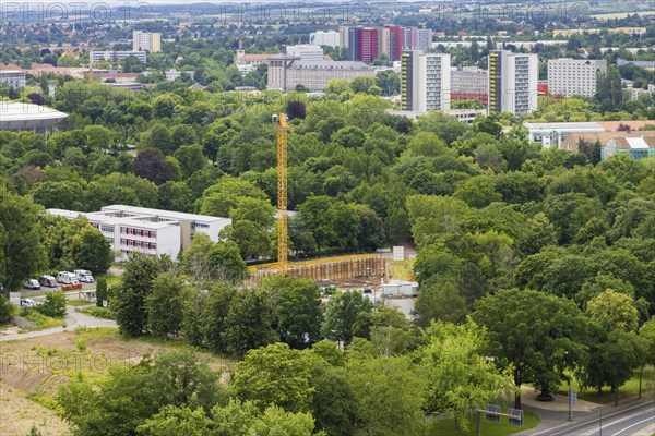 View from the town hall tower over the inner old town to the Bürgerwiese, where the first new building of the development of the Lingner area is being built