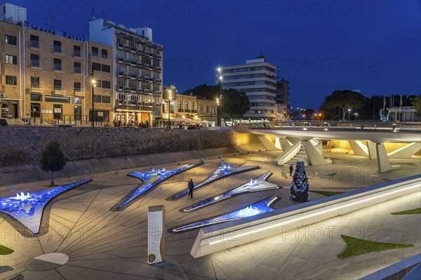 Modern architecture and colourfully lit fountains of Eleftheria Square at dusk, Nicosia, Cyprus, Europe