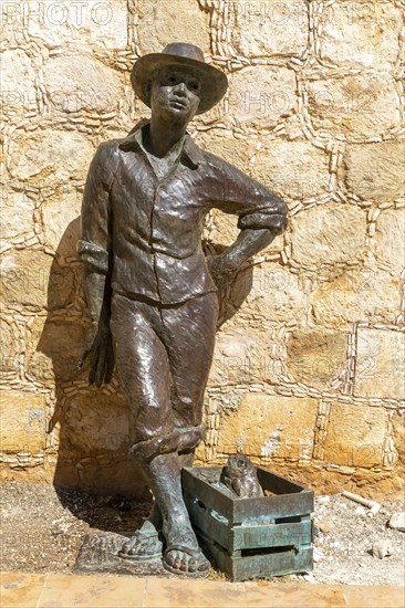 Bronze sculpture statue of a fisherman by city wall Campeche, Campeche State, Mexico, Central America