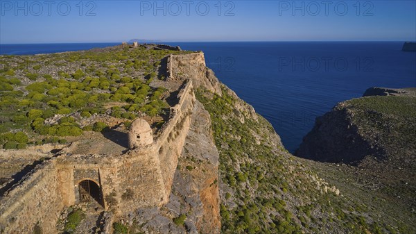Drone shot, A historic fortress ruin running along a cliff and looking down to the sea, Venetian Sea Fortress, Gramvoussa, Gramvoussa Peninsula, Pirate Bay, Balos, Lagoon, Northwest Crete, Crete, Greek Islands, Greece, Europe