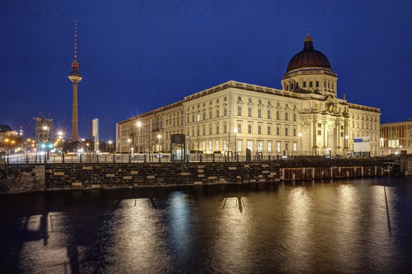 The rebuilt city palace and the television tower in Berlin by night