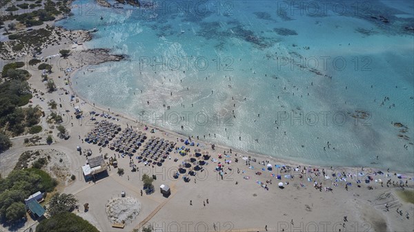 Overtourism, aerial view of a beach with many people and umbrellas, surrounded by clear water, Elafonissi, lagoon, south-west tip of Crete, Crete, Greek Islands, Greece, Europe