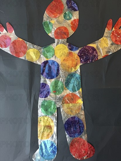 A vibrant human figure collage adorned with colorful circles on a dark background, AI generated