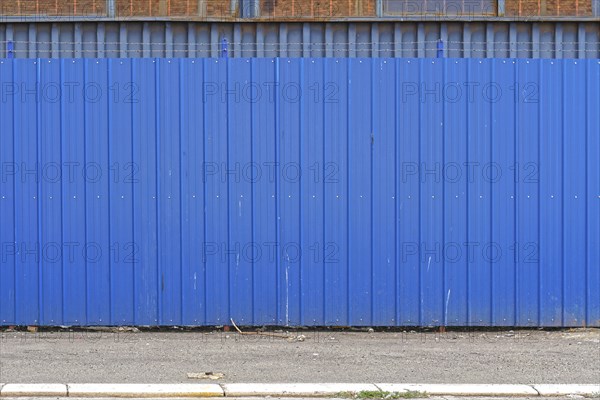 Corrugated steel metal blue fence exterior