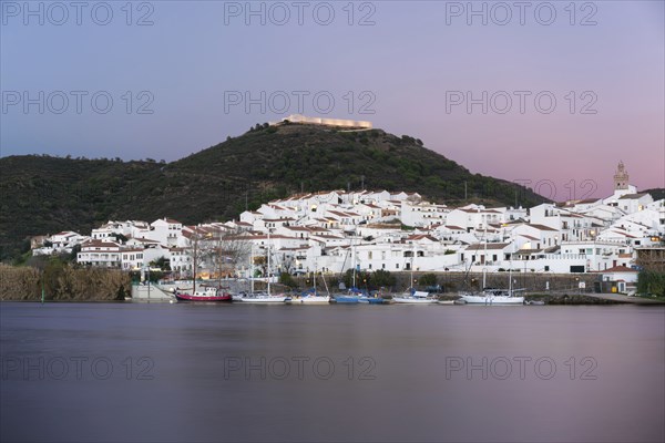 Sanlucar de Guadiana in Spain and Alcoutim in Portugal with sail boats on Guadiana river