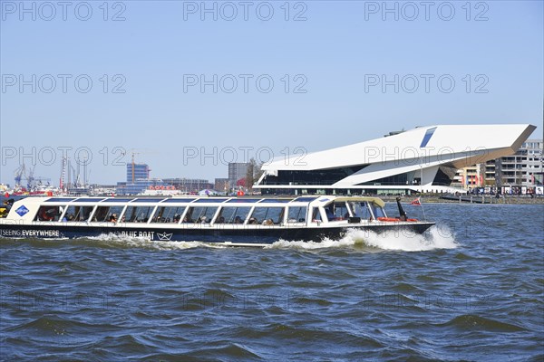 Amsterdam, Netherlands. April 2023. The river IJ with the Eye museum and a canalboat