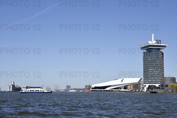 Amsterdam, Netherlands. April 2023. The river IJ with the Eye museum and a canalboat