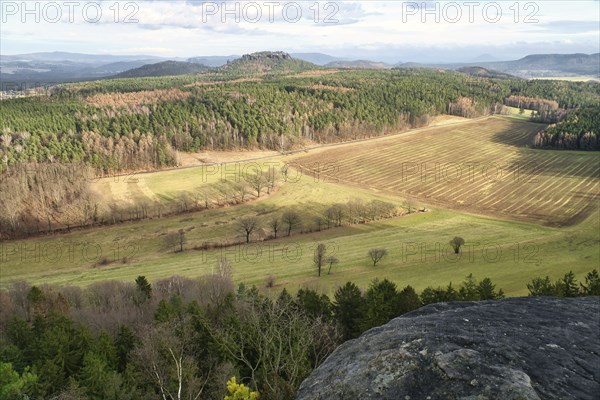 View from the Pfaffenstein. Forests, mountains, fields, vastness, panorama. Landscape from the Elbe Sandstone Mountains