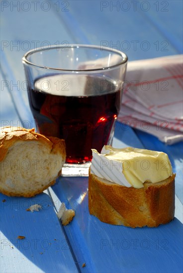 Soft cheese with baguette and glass of red wine