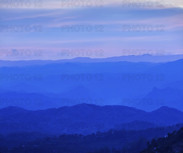 Sunset in mountains in Munnar. Kerala, South India