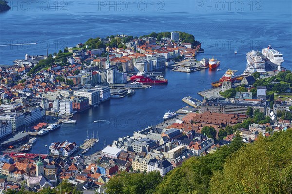 Picturesque harbour of Bergen with buildings, boats and houses, surrounded by water and green landscape, Fløibanen mountain station, Bergen, Vestland, Norway, Europe
