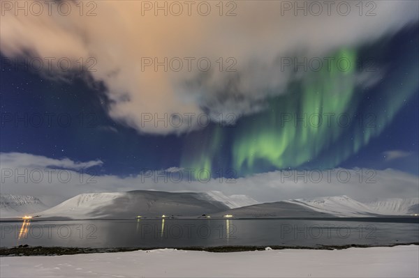 Northern Lights over fjord landscape, Aurora borealis, snow, winter, mountains, Thingeyri, Westfjords, Iceland, Europe