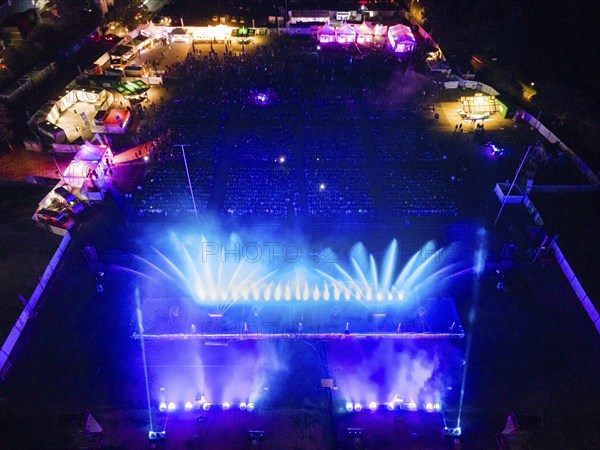 At Elementaro, a water and light show taking place in Bad Vilbel from 20 to 22 September 2024, the combination of moving water fountains over 35 metres high, classical, modern and nostalgic music, fantastic images and emotional videos, an oversized large water wall, impressive fire compartments and countless lasers captivates the audience. (Aerial view with a drone), Bad Vilbel, Hesse, Germany, Europe