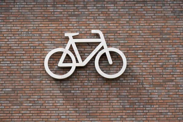 Bicycle symbol on a wall, pictogram, bicycle car park, Dülmen, Münsterland, North Rhine-Westphalia, Germany, Europe