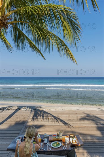 Breakfast under palm trees, travel, tourism, tourism, holiday, food, sea, beach, palm tree, ocean, beach holiday, dream holiday, holiday dream, morning mood, holiday mood, authentic, luxury, luxurious Indonesia