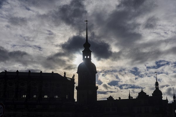Rainy weather in Dresden's old town. The steep winter sun emphasises the silhouettes of the historic buildings Residenzschloss with Hausmannsturm and Hofkirche, Dresden, Saxony, Germany, Europe