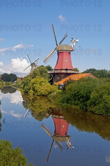 Twin mills Greetsiel at the old Greetsieler Sieltief, Krummhörn-Greetsiel. East Frisia, Lower Saxony, Germany, Europe