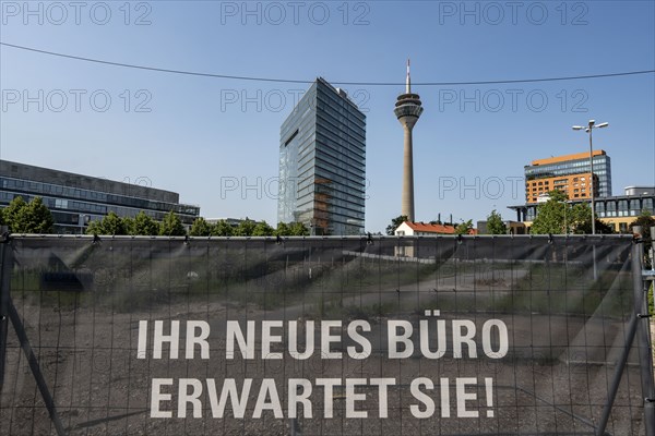 Construction project Pandion Rise, office building and Pandion Next, residential building, in the city centre of Düsseldorf, construction fence, advertising for the real estate project, excavation pit, city gate building, North Rhine-Westphalia, Germany, Europe