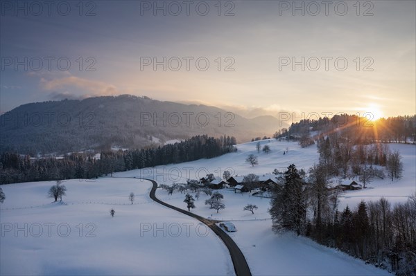 Sunset, Kiefersau am Buchberg in winter, behind Blomberg, drone shot, Tölzer Land, Upper Bavaria, Bavaria, Germany, Europe