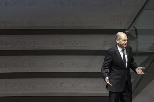 Olaf Scholz (SPD), Federal Chancellor, arrives in the plenary chamber of the German Bundestag in Berlin. Among other things, the 2024 federal budget will be discussed today. 30.01.2024