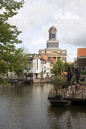 View over Rijn canal waterway to Hartebrugkerk church Leiden, Netherlands