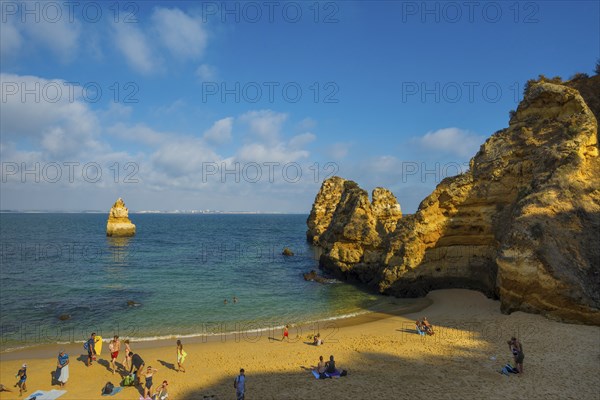 Rocky coast with beach and red rocks, Praia do Camilo, Lagos, Algarve, Portugal, Europe