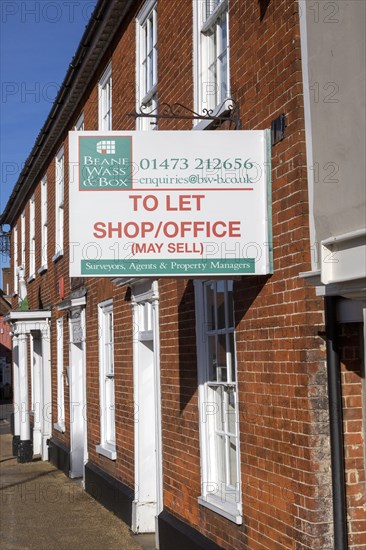 Estate agent commercial property To Let Shop Office sign, Wickham Market, Suffolk, England, UK