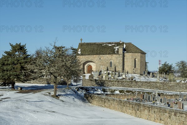 Cemetery and chapel of Saint-Pierre-le-Vieux in winter. Lozere department. Occitanie. France